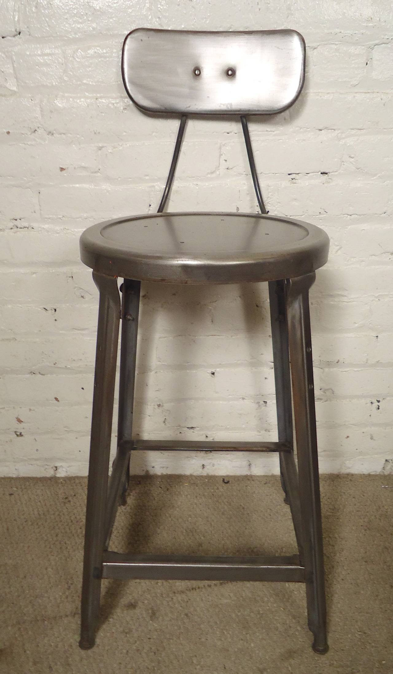 Vintage factory stools refinished with a bare metal style finish. Smaller than the average stool at 24