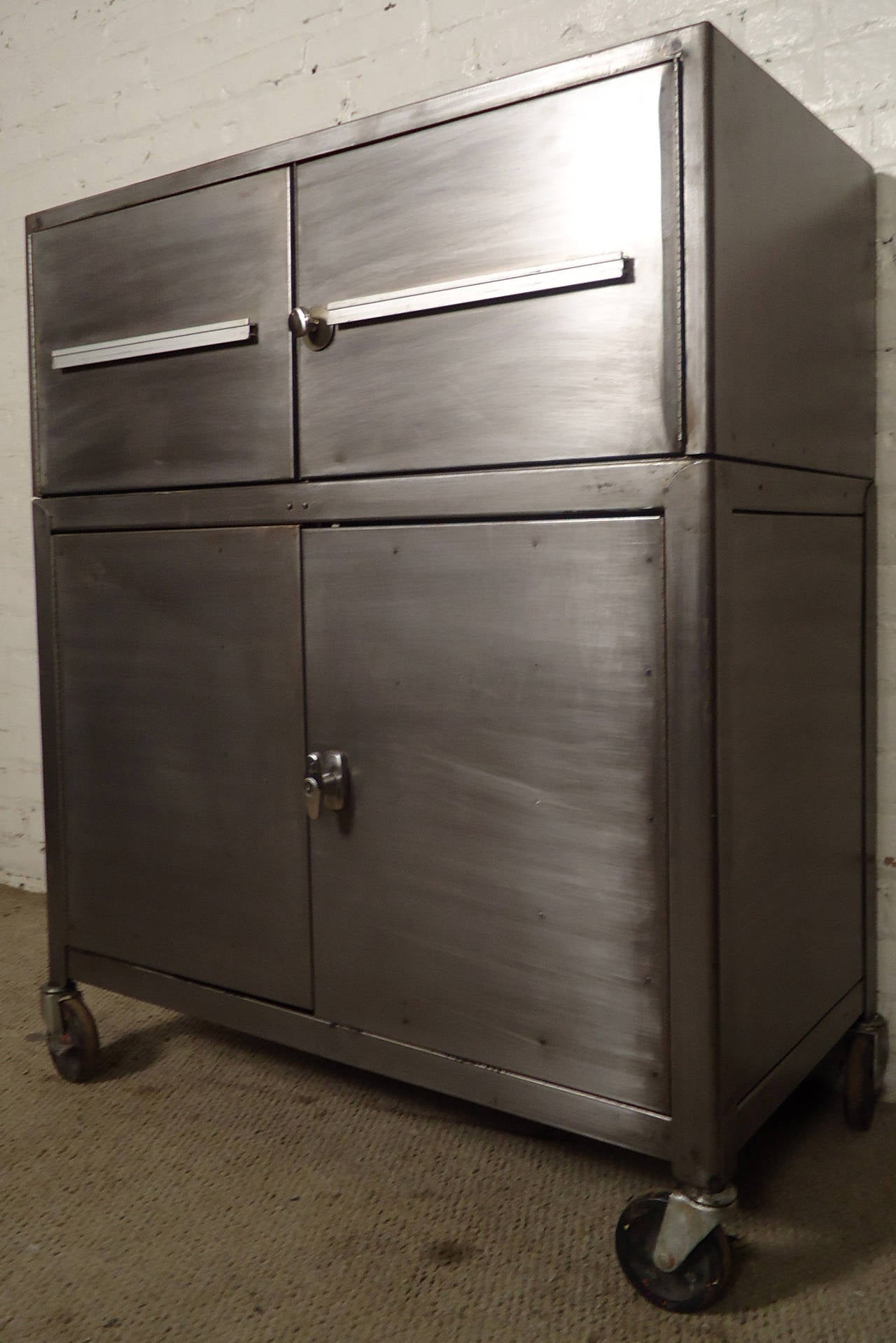 Stripped industrial metal cabinet featuring four doors, and lockable castor wheels.

(Please confirm item location - NY or NJ - with dealer)