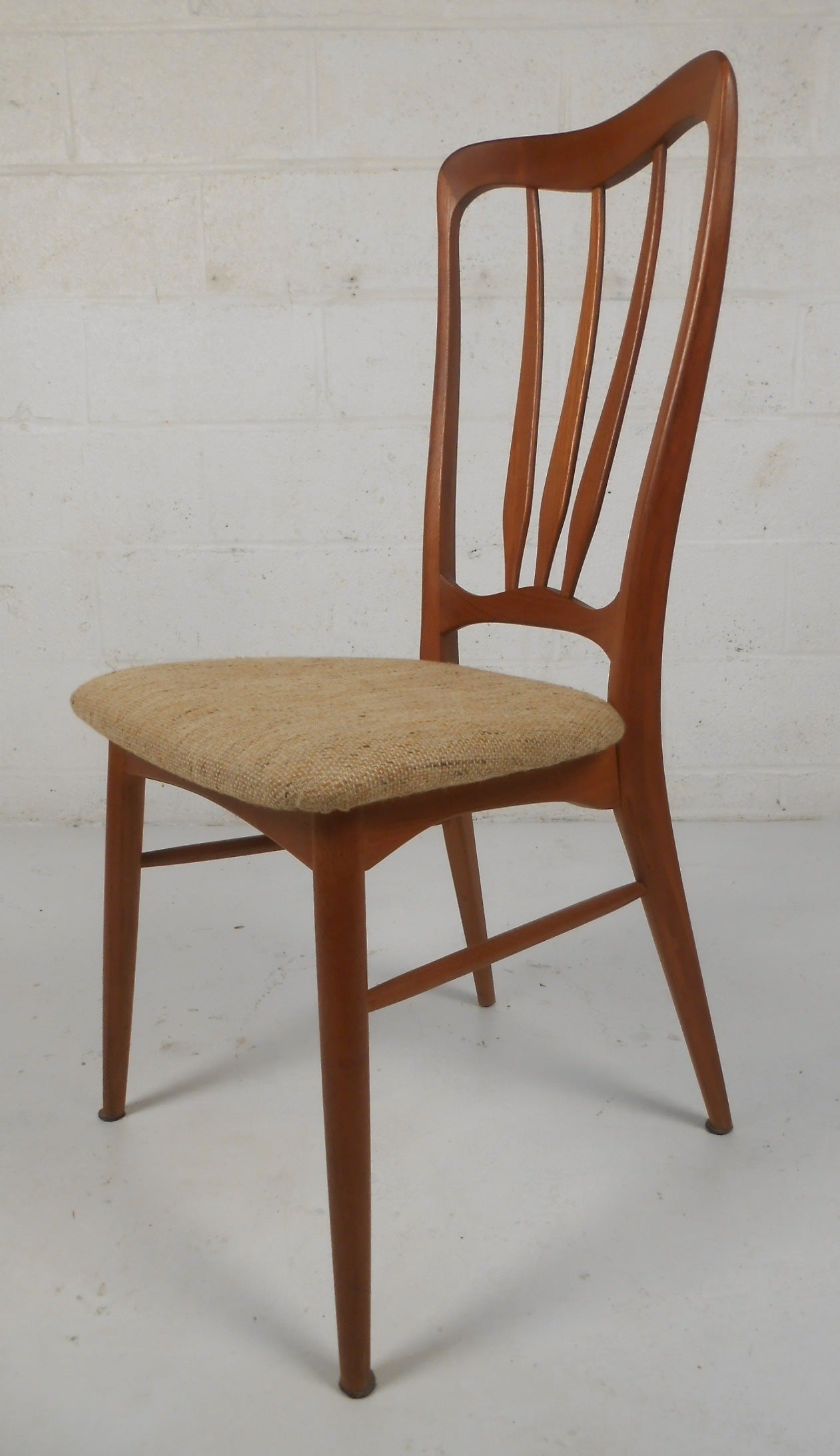 Set of six well crafted Danish modern dining chairs in teak. Please confirm item location (NY or NJ) with dealer.