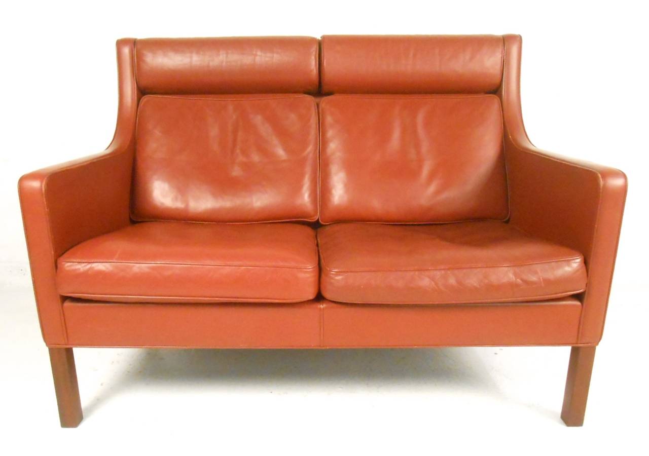 This two person loveseat sofa features the wonderful Danish design of Borge Mogensen. Comfortable seating with unique high back design makes this the perfect addition to any midcentury style interior. Please confirm item location (NY or NJ).