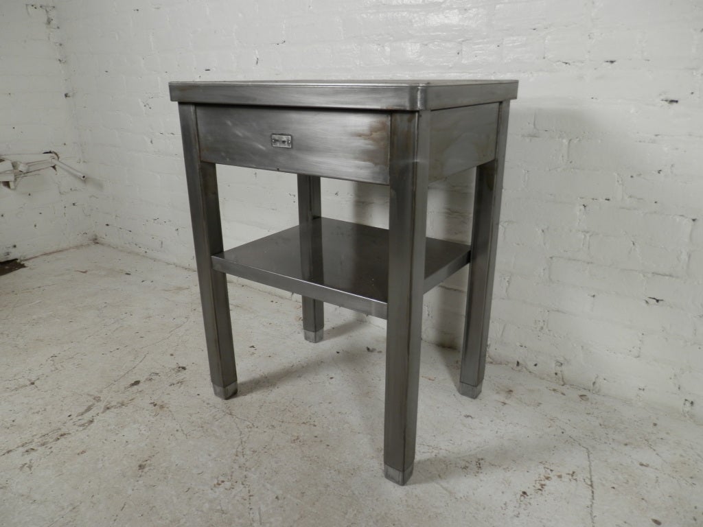 A fine example of vintage commercial all metal furniture, stripped down to its natural beauty.
