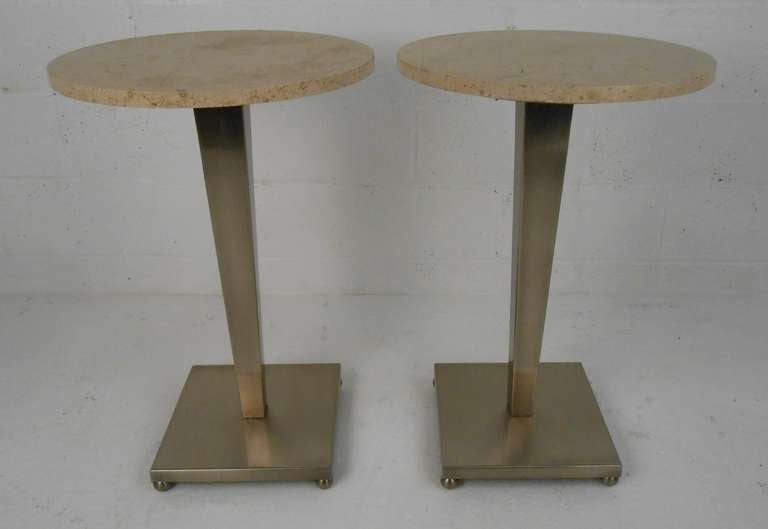 Travertine top end tables with brushed stainless base and ball-feet levelers. Please confirm item location (NY or NJ) with dealer.