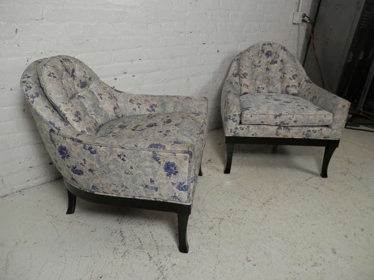 Pair of vintage modern armchairs with beautifully rounded backs and flared black legs. Tufted back cushions and long arms.

Please confirm item location - NY or NJ - with dealer.