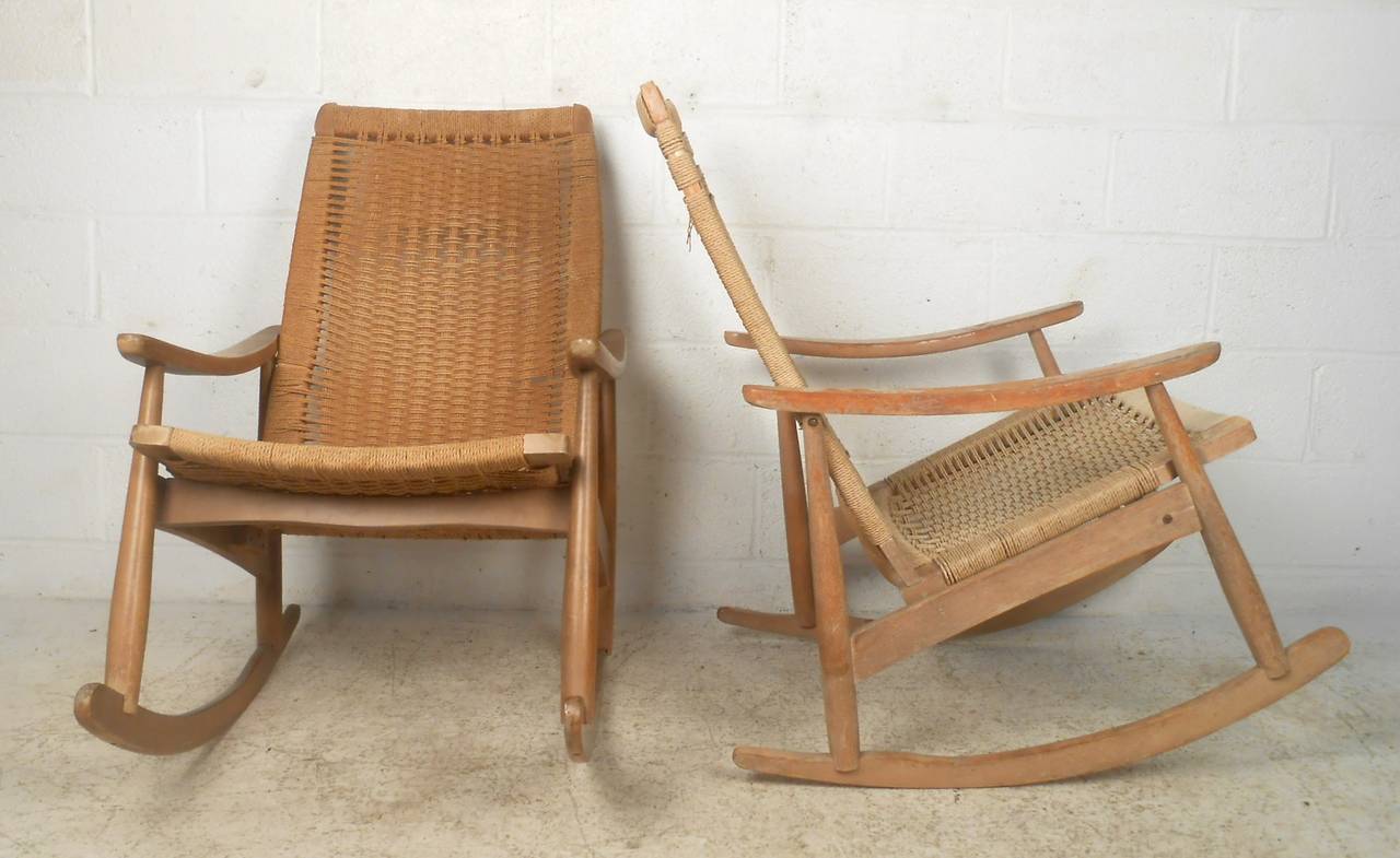 Pair of vintage rockers with woven seats and back make a beautiful Mid-Century Modern addition to home or business seating area. Unique rope seats, comfortable seat proportions, and Danish modern style add to the appeal of the piece. 

(Please