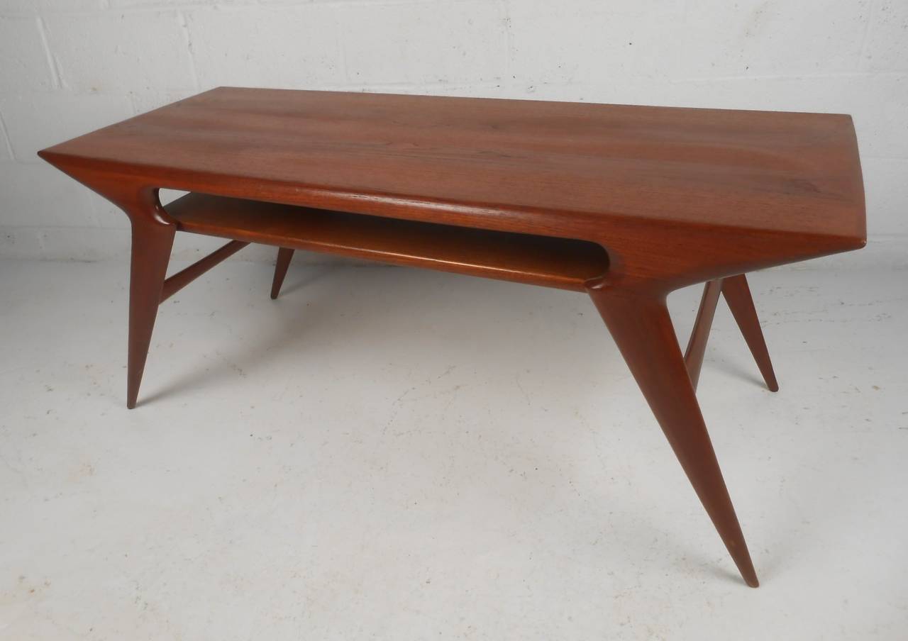 Stunning sculptural teak coffee table designed by Johannes Andersen, circa 1950s. Makes an impressive cocktail table in any setting. Stylish Scandinavian modern design, please confirm item location (NY or NJ) with dealer.