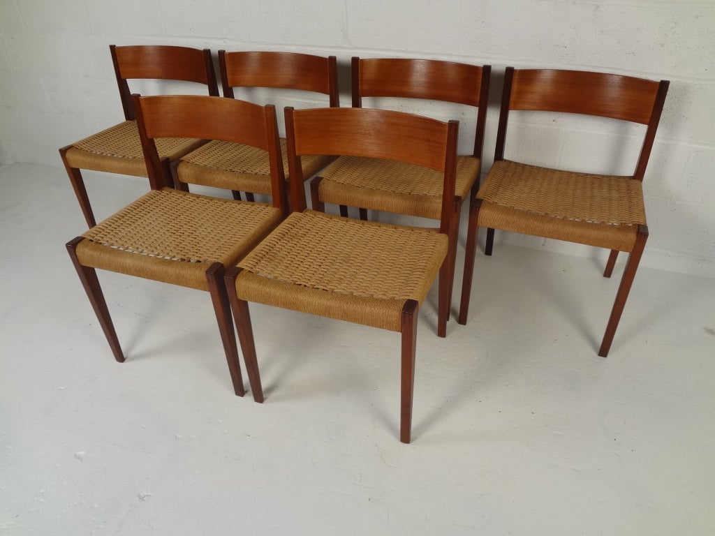 Danish teak chairs with paper cord seats and mortised leg joints designed by Poul Cadovius for Cado. (Six more available).