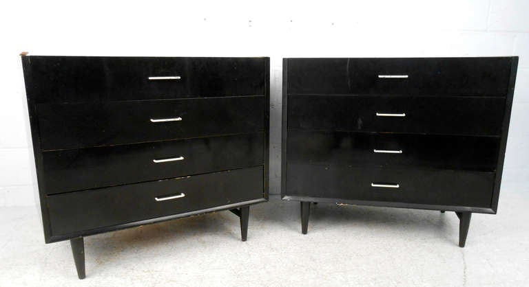 This matching pair of American of Martinsville dressers features white formica style tops, tapered legs, and four drawers offering plenty of storage space. Please confirm item location (NY or NJ).