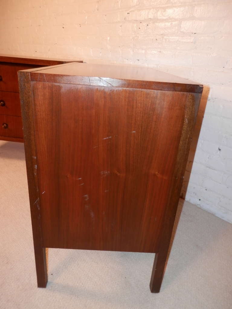 Pair of mini dressers by Basic Witz with three drawers and original brass pulls surrounded by a dark inlay wood. Clean modern lines. Used as dressers or nightstands.

(Please confirm item location - NY or NJ - with dealer)