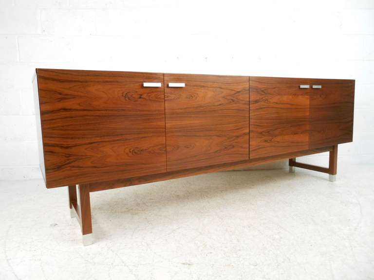 Low rosewood sideboard designed by Kai Kristiansen and produced by Preben Skov Andersen, PSA Furniture, Denmark. Please confirm item location (NY or NJ) with dealer.