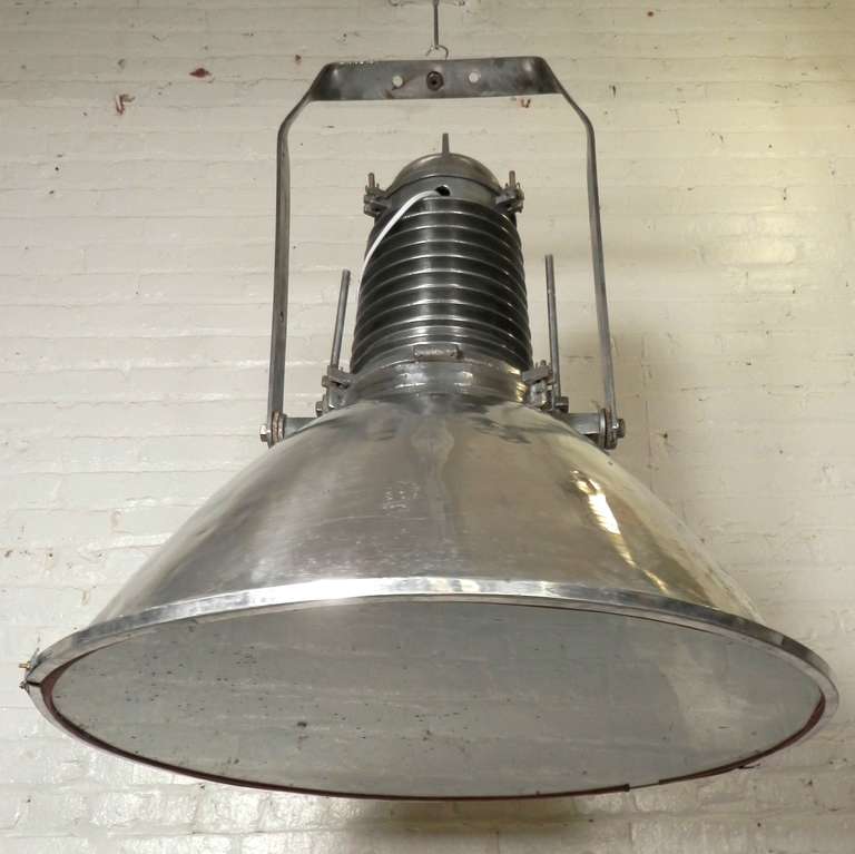 Factory size industrial metal lamp with glass shade. Makes for a unique vintage machine style chandelier. Can be hung or fixed to a stand for floor lighting.

(Please confirm item location - NY or NJ - with dealer)
