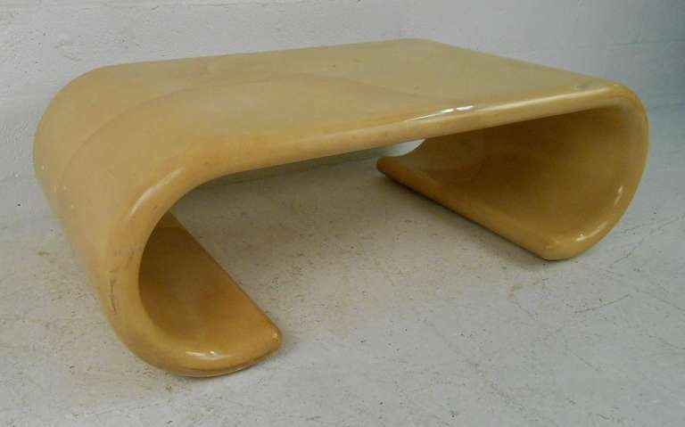 This stylish waterfall coffee table with faux skin finish features unique sculptural mid-century modern design in the style of Karl Springer. 
Item location: Brooklyn NY