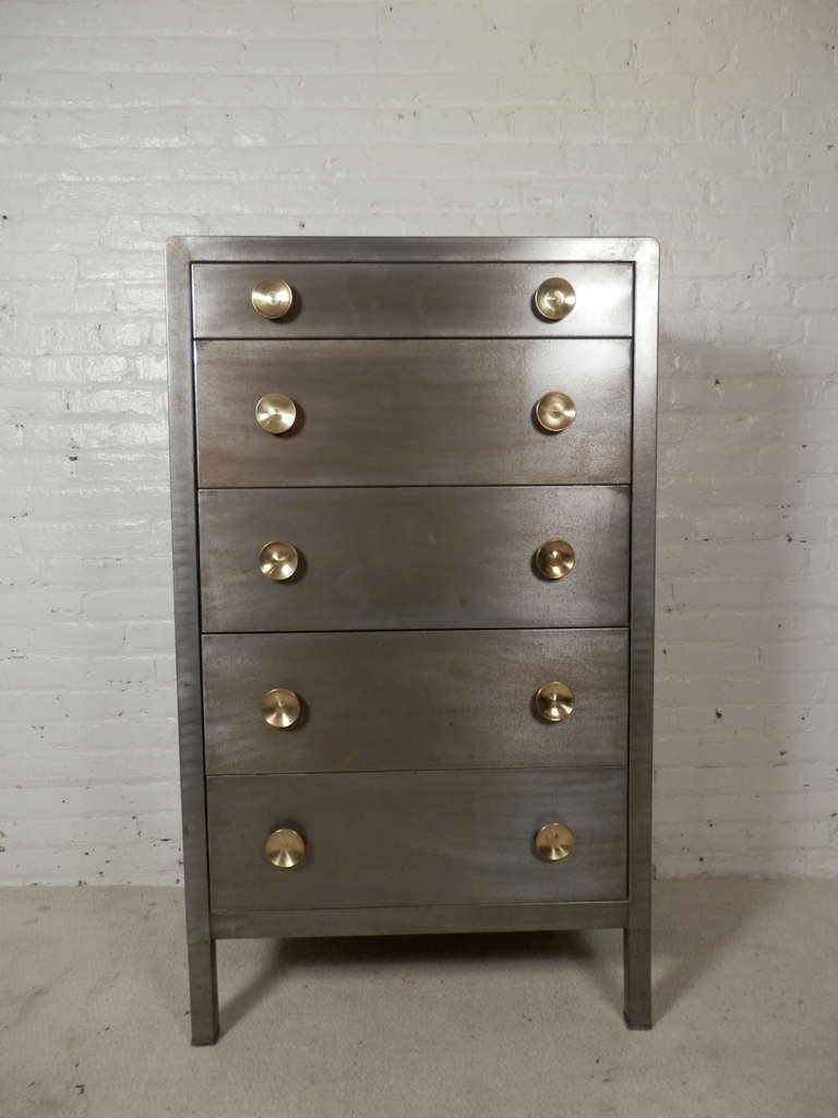 Rare hiboy five drawer dresser by Simmons. Usually this rounded top style of Norman Bel Geddes dressers are smaller with only three or four drawers. This tall dresser features original gold color handles that accent the bare metal look of the