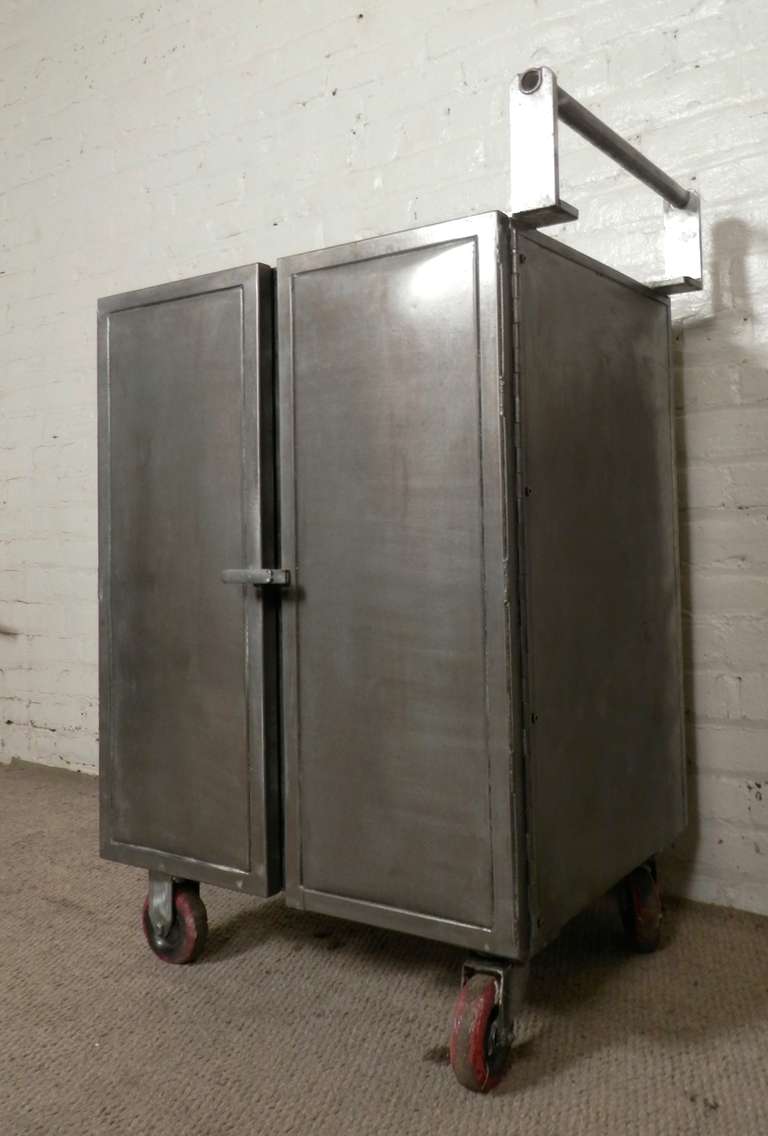 Heavy duty factory cart on large rolling casters with multiple wire bins. Two door cabinet with a simple and unusual pull lock handle. Great for use in the kitchen or bathroom.

(Please confirm item location - NY or NJ - with dealer)