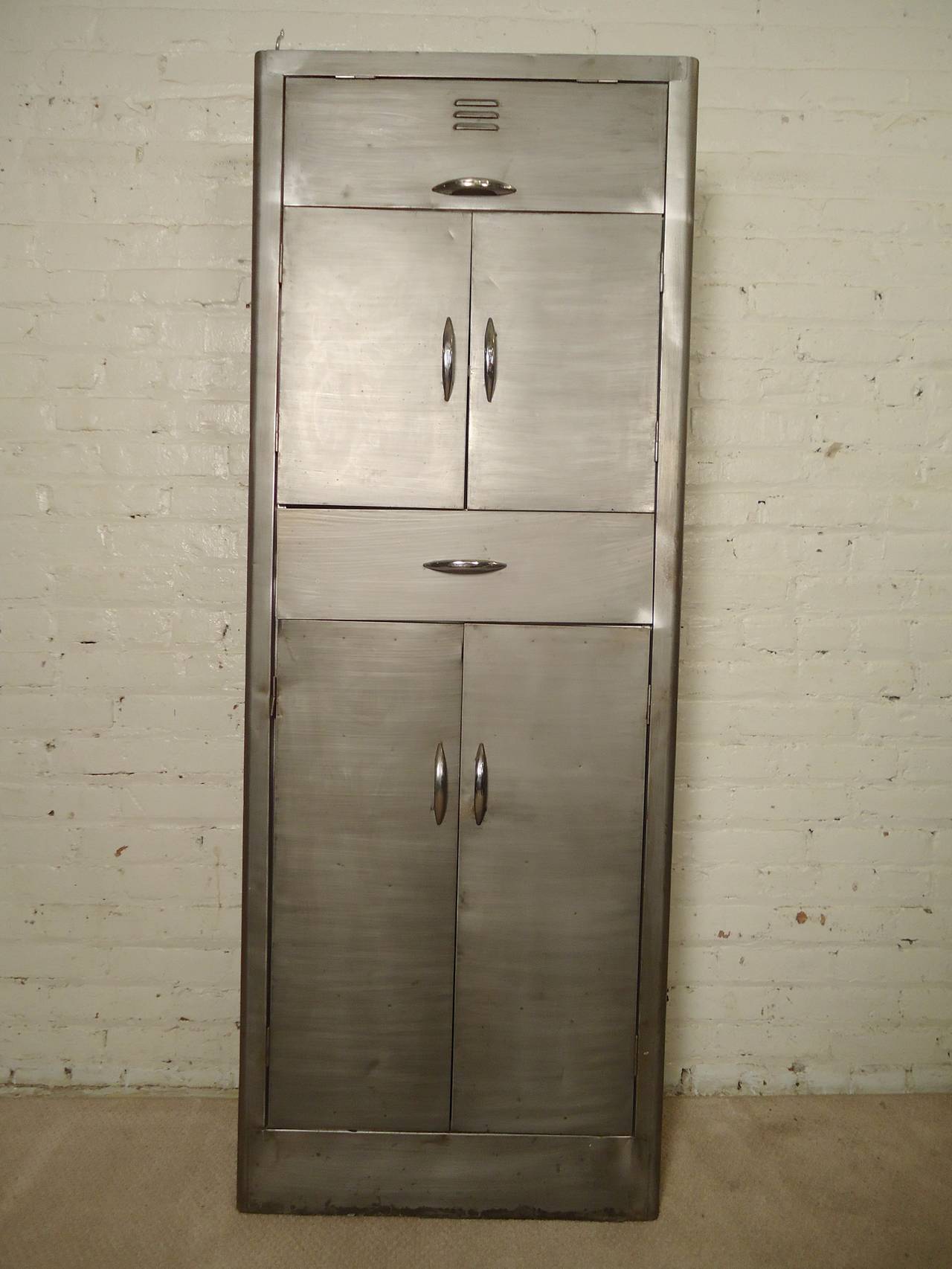 Vintage metal cabinet with varying storage. Shallow depth allows for storage in smaller kitchens or bathrooms.

(Please confirm item location - NY or NJ - with dealer)