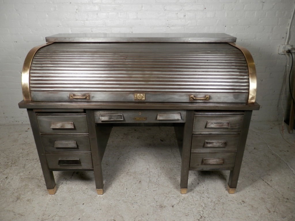 Remarkable roll top desk with brass trim all finely stripped to bare metal. Very rare industrial item! Please confirm item location (NY or NJ) with dealer.
