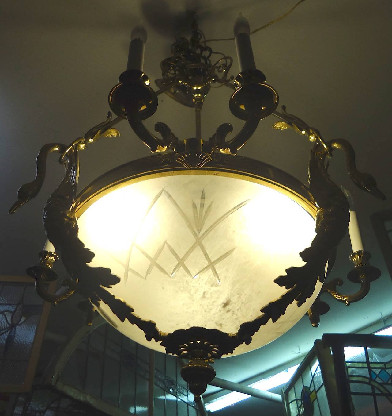 Vintage chandelier with heavy bronze frame and etched glass dome. Beautiful trimmings throughout, three sockets under glass, six candelabra sockets around.

(Please confirm item location NY or NJ with dealer).