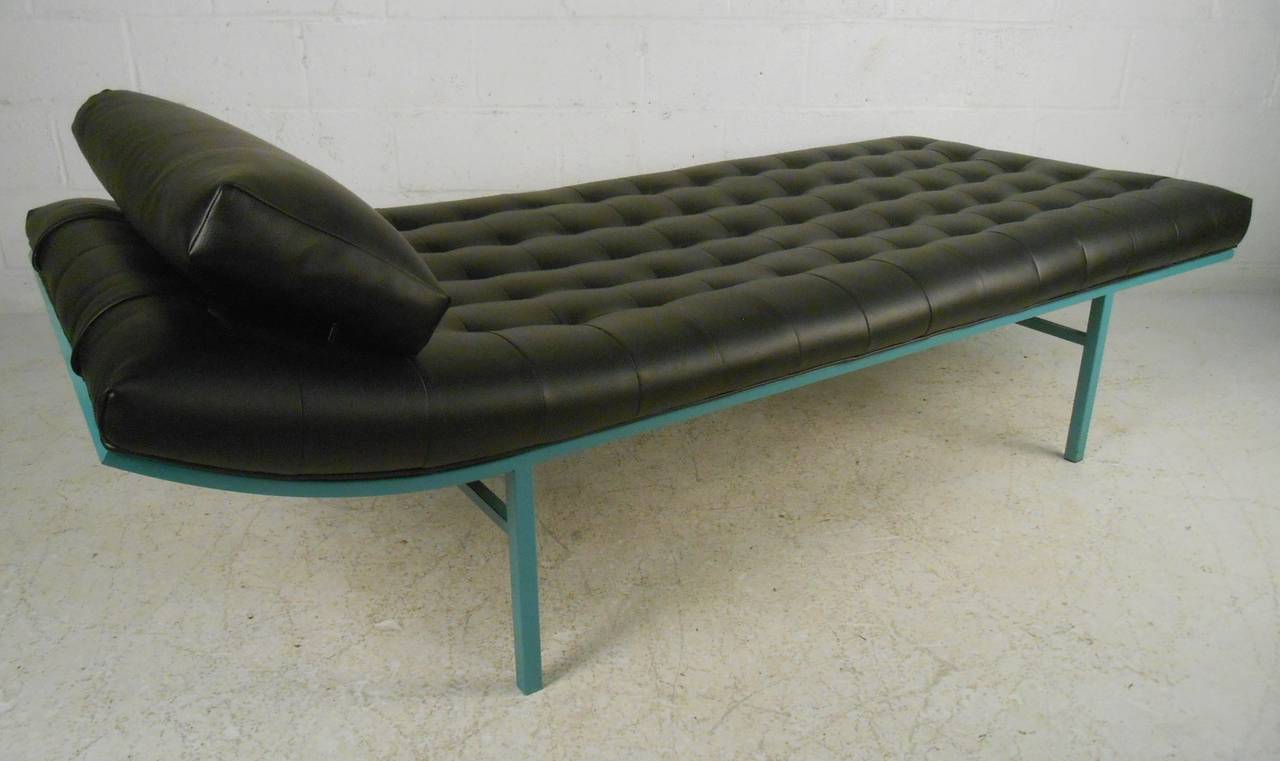 Contemporary vinyl tufted chaise lounge with teal colored metal frame makes a unique retro daybed for home or office. Comfortably upholstered and built-in pillow, please confirm item location (NY or NJ) with dealer.