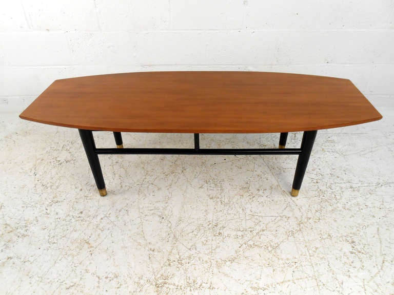 This beautiful Drexel branded coffee table features mid-century design, sturdy legs with stretchers, and uniquely shaped table top. Makes a wonderful cocktail table in any home or business. Please confirm item location (NY or NJ).