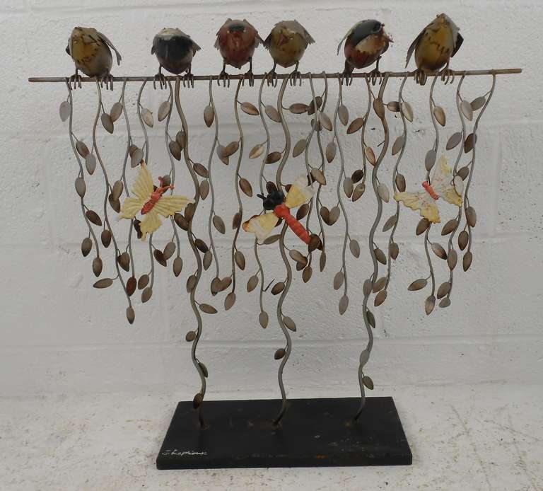 Colorful vintage metal sculpture features birds, butterflies and vines. Signed by the artist. Please confirm item location (NY or NJ) with dealer.