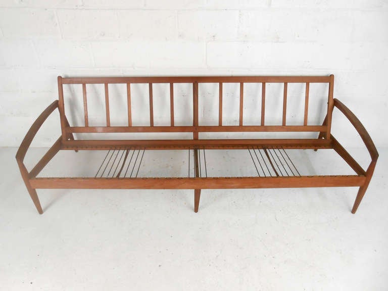 This vintage Hans Wegner style sofa is in need of some restoration, but provides the perfect frame for any mid-century space. Please confirm item location (NY or NJ).