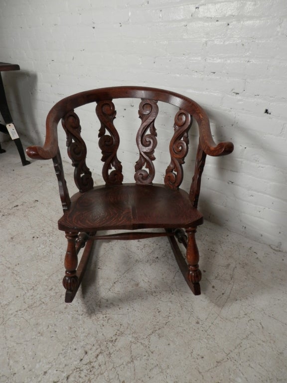 Antique rocker made of beautiful tiger oak. Great detailed carving.