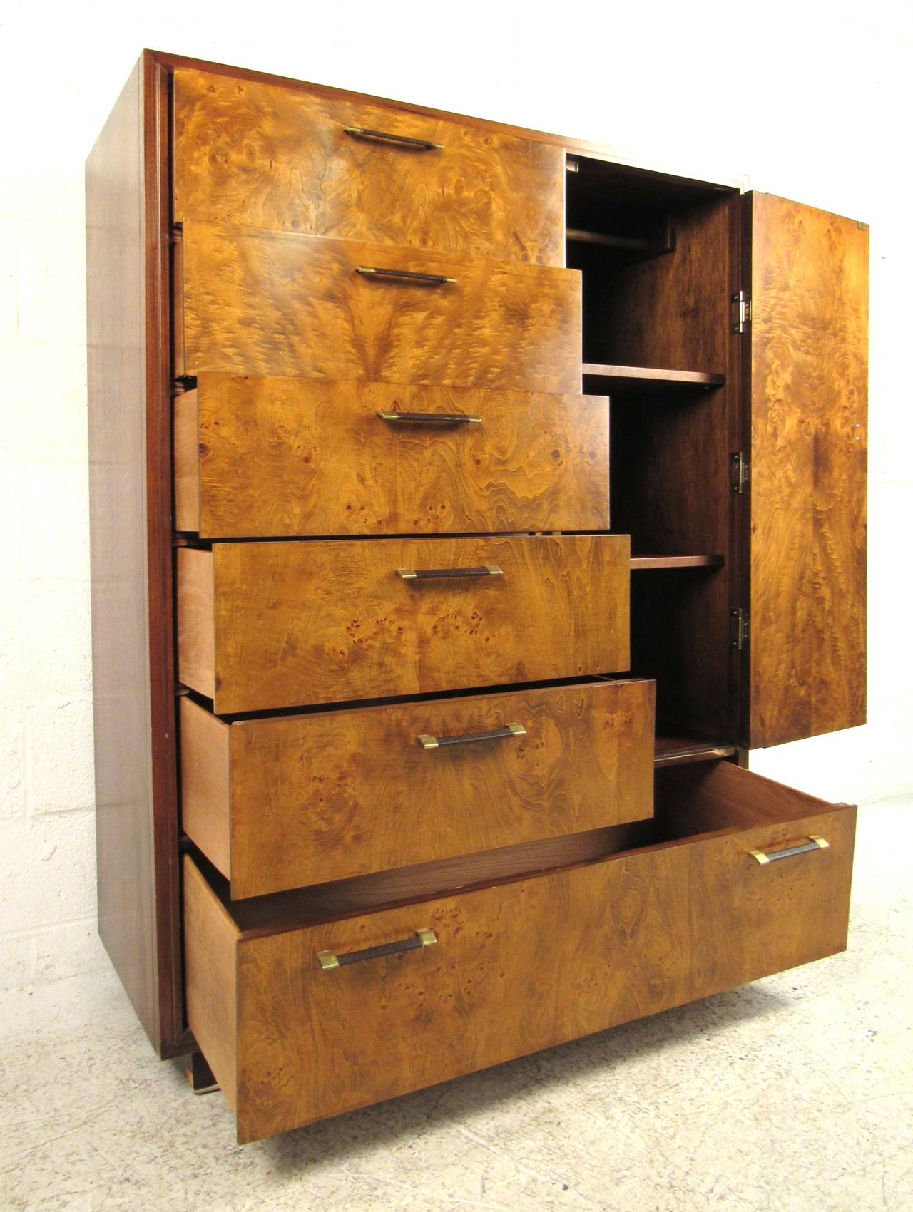 Striking gentleman's chest of drawers in exotic Mozambique and Lagoda burl wood veneers. Please confirm item location (NY or NJ) with dealer.