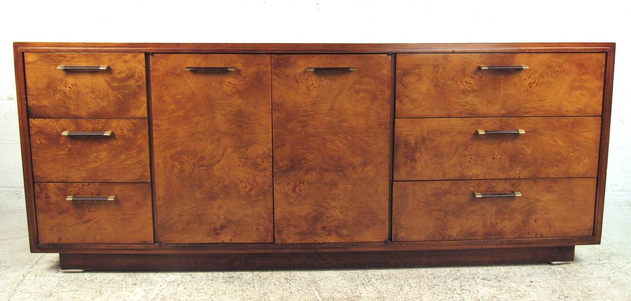 Beautiful nine-drawer dresser with dramatic Mozambique & Lagoda burl veneers and brass/leather drawer pulls. Please confirm item location (NY or NJ) with dealer.