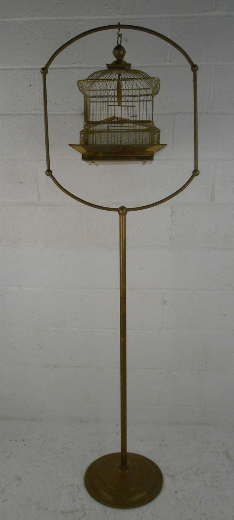 Ornate vintage brass bird cage and stand by Hendryx. Please confirm item location (NY or NJ) with dealer.