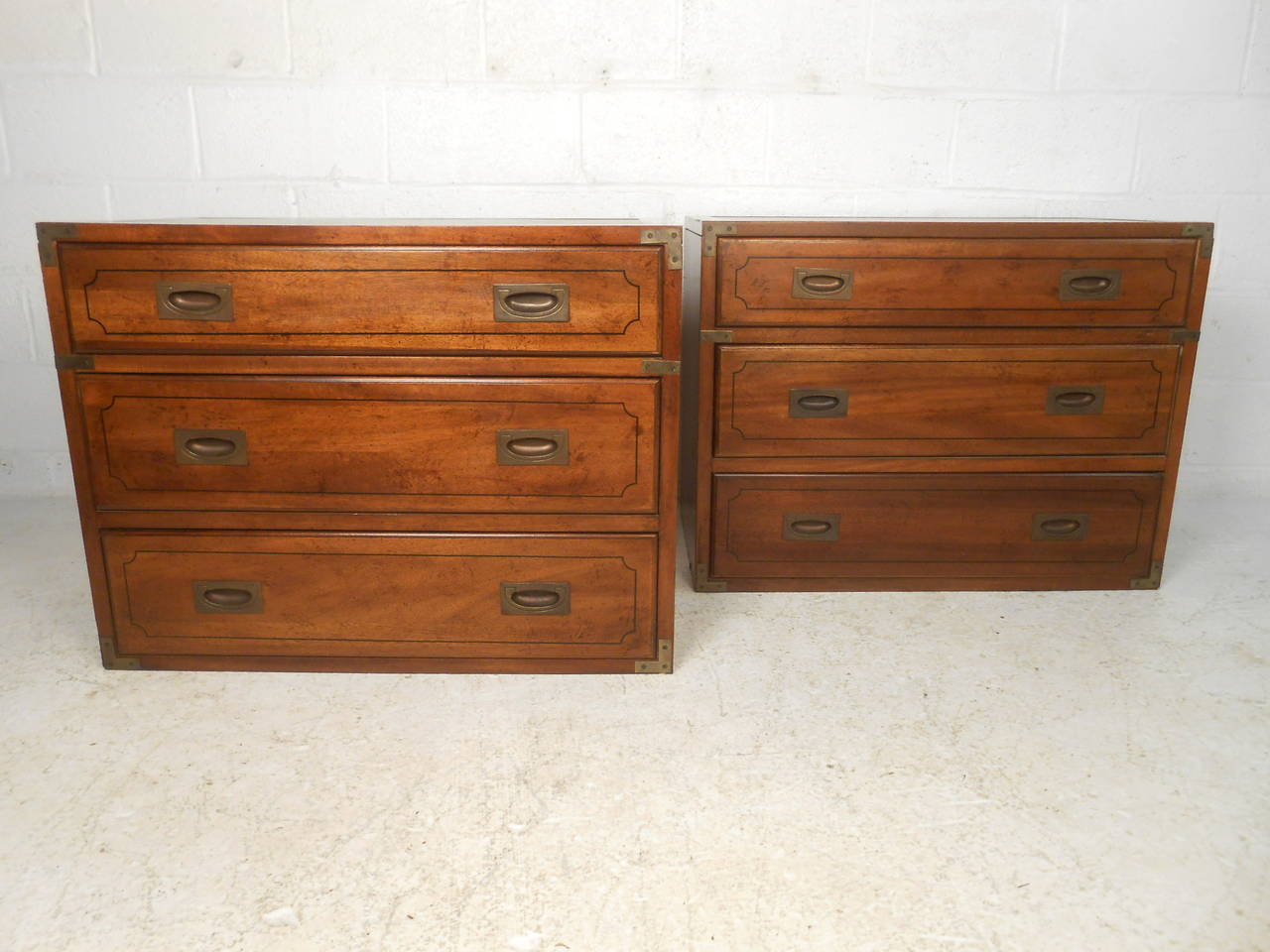 This pair of campaign chests by Globe Furniture feature solid wood construction, leather top and brass hardware which offer a bold, modern flare to any home or office space.  

Please confirm item location (NY or NJ) with dealer.