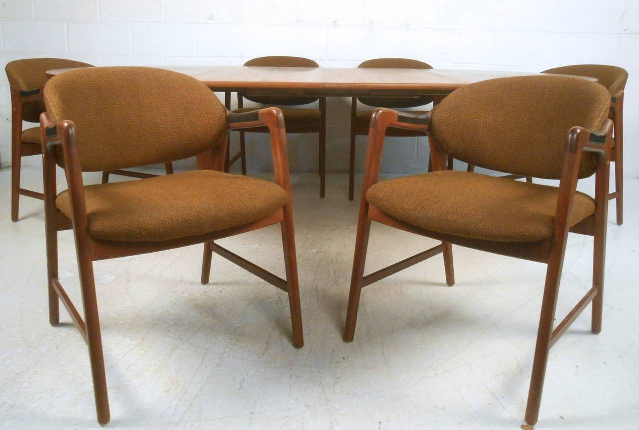 This wonderful vintage dining set features six Westnofa armchairs, complete with vintage fabric and leather armrests. Paired perfectly with this circular Moller style table, which opens from 51