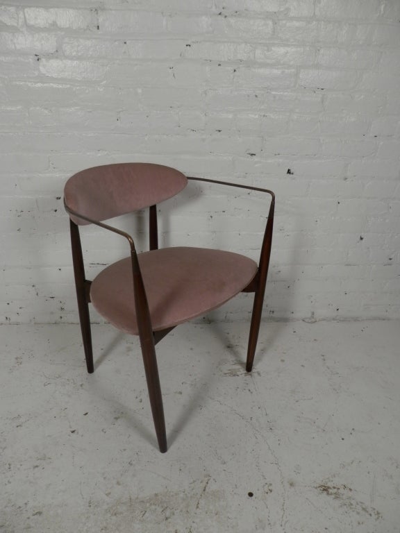Iconic 'Drumstick' chair by Danish designer Ib Kofod Larsen. Great mid-century modern design with brass arms.