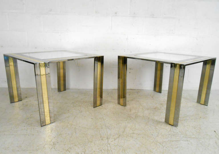 This pair of mirrored midcentury end tables features Paul Evans style design, combining sturdy chrome bases with glass tops. Perfect modernist addition to any home or business. Please confirm item locations (NY or NJ).