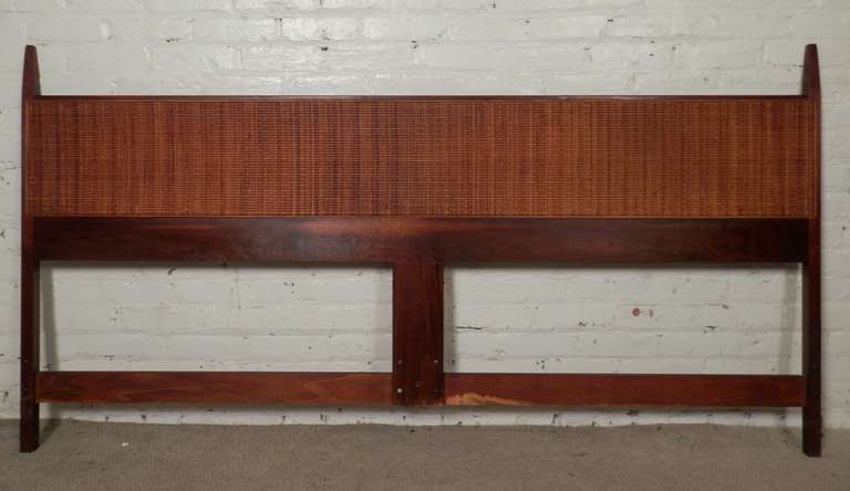 American made 1960's walnut headboard featuring hand woven cane wicker back. Elegant addition to any king size bed.

(Please confirm item location - NY or NJ - with dealer)