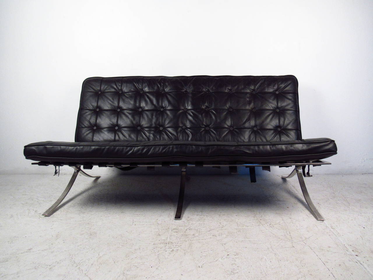 This beautiful sofa features wonderful tufted upholstery and a sturdy chrome frame. This classic mid-century design makes a stylish and comfortable addition to any interior. Please confirm item location (NY or NJ).