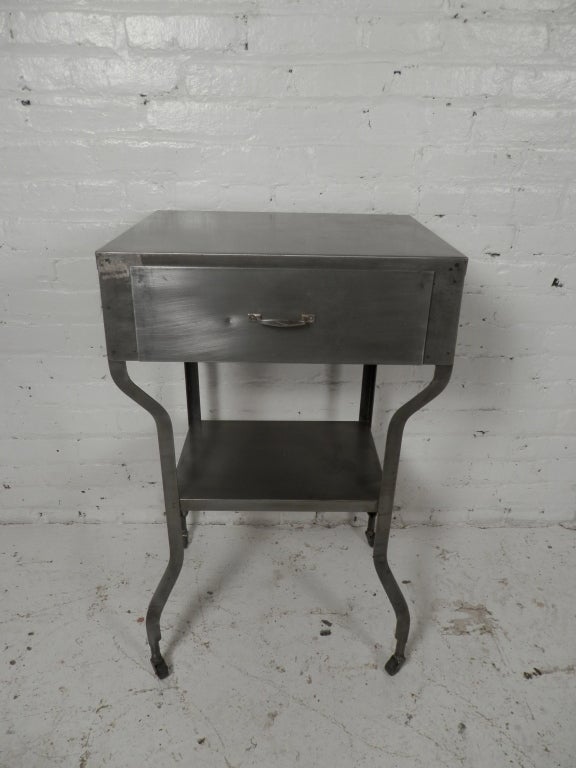 Vintage medical table makes a perfect side/sofa/bed side table.