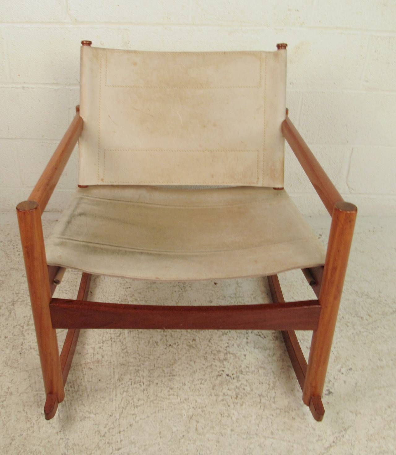 Beautiful mid-century rocking chair from Brazil designed by Michel Arnoult. Teak frame with leather seat and back. Very comfortable. Footrest also available in separate listing.

(Please confirm item location - NY or NJ - with dealer)