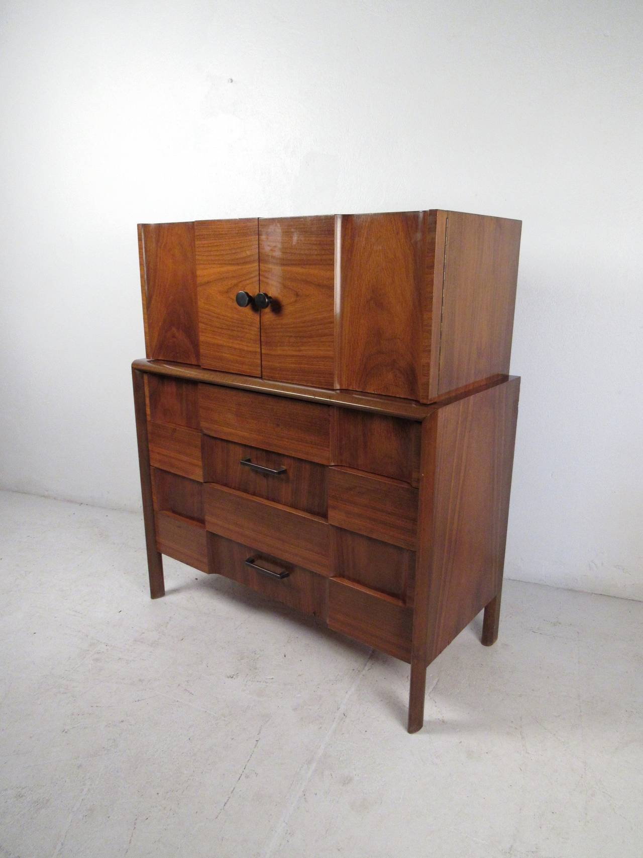 This midcentury high boy dresser features a beautiful patchwork finish in the style of Paul Evans which offers a modern flare to any home or office space.

Please confirm item location (NY or NJ) with dealer.
