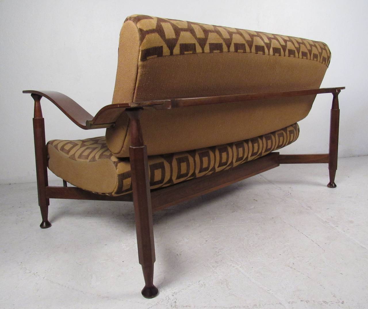 Dramatic two-seat sofa settee with swooping arms and floating seat cushion. Please confirm item location (NY or NJ) with dealer.