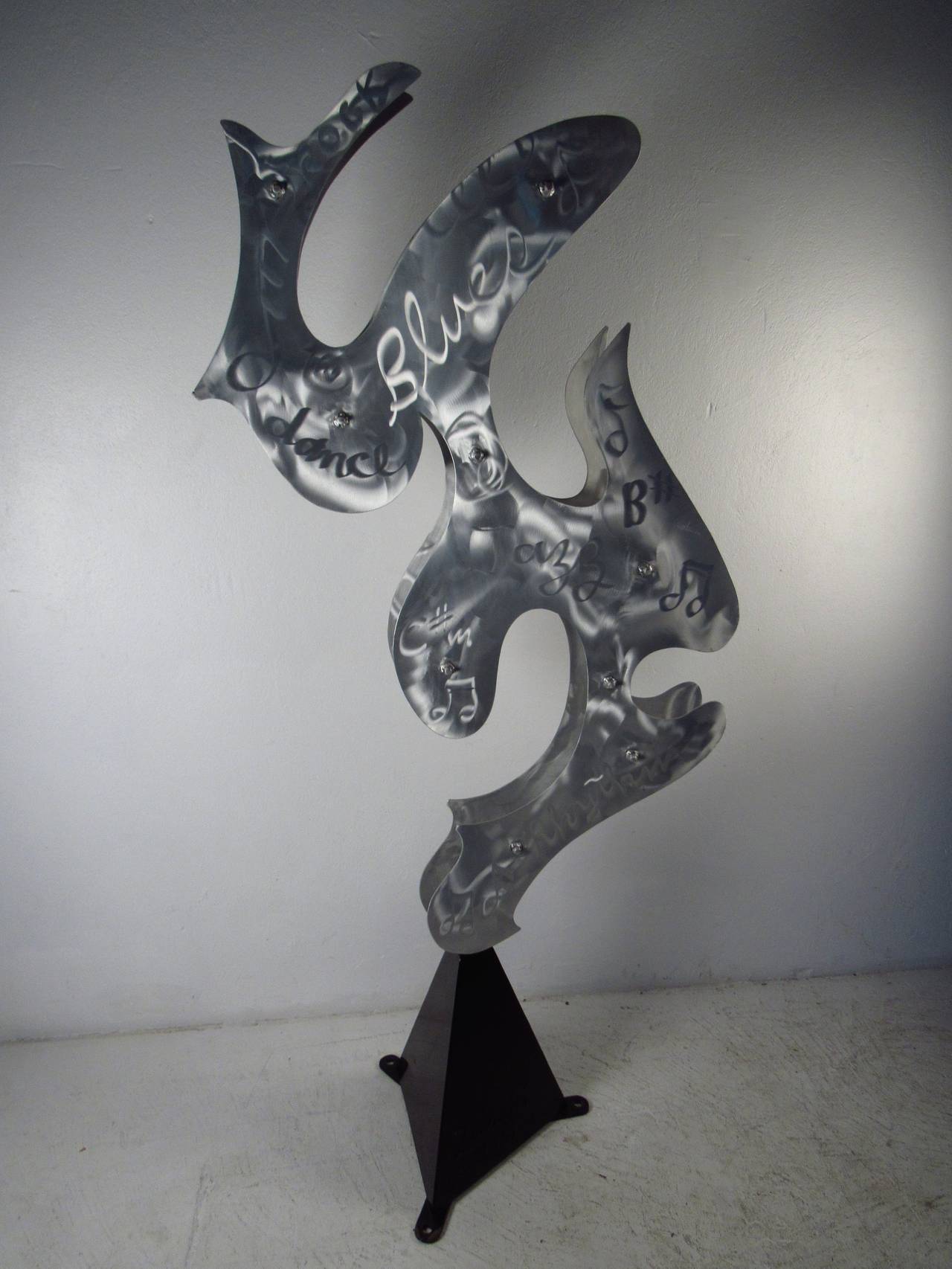 Enameled aluminum sculpture with a music theme by international artist and sculptor, Steve Zaluski. Impressive artwork for home or business. Please confirm item location (NY or NJ) with dealer.