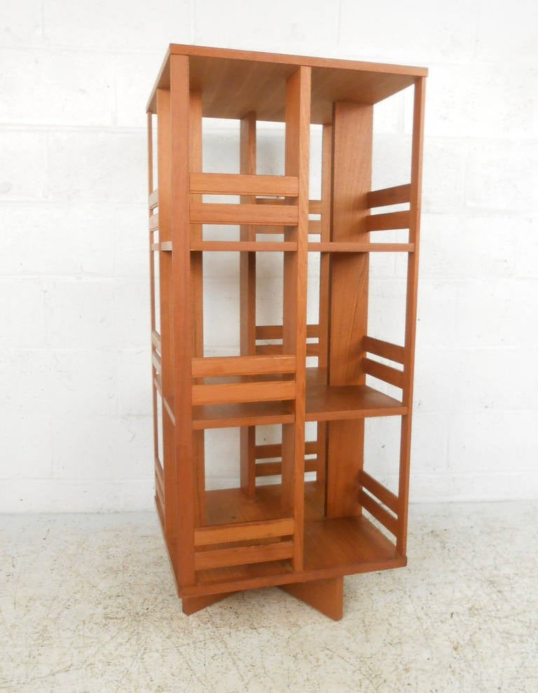 This unique teak bookcase features a sturdy swivel base that makes finding the book or video of your choosing simple and fast. A great way to save space in tight quarters this mid-century classic is perfect for the modern home or office. Please
