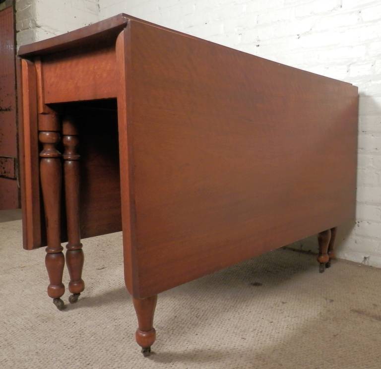 Antique Drop Leaf Table On Casters