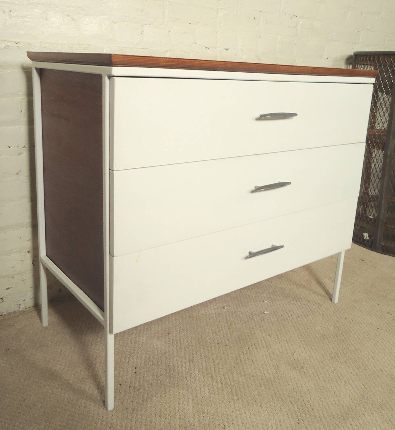 D.R. Bates & Jackson Gregory Jr. designed dresser with white front and matching iron frame. Accenting wood top and sides, original curved handles.

(Please confirm item location - NY or NJ - with dealer)