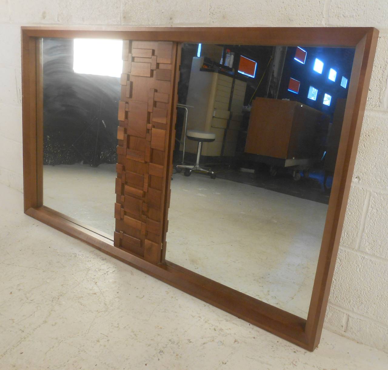 Striking brutalist mirror with unique mid-century modern design and sculptural wood design. Can be used as a dressing mirror or adapted to hang on a wall. (Please confirm item location - NY or NJ - with dealer)