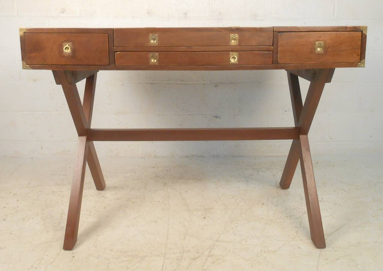 Vintage captain's desk with great detailing and X base legs. Flip top storage, brass hardware, removable top.

(Please confirm item location - NY or NJ - with dealer)