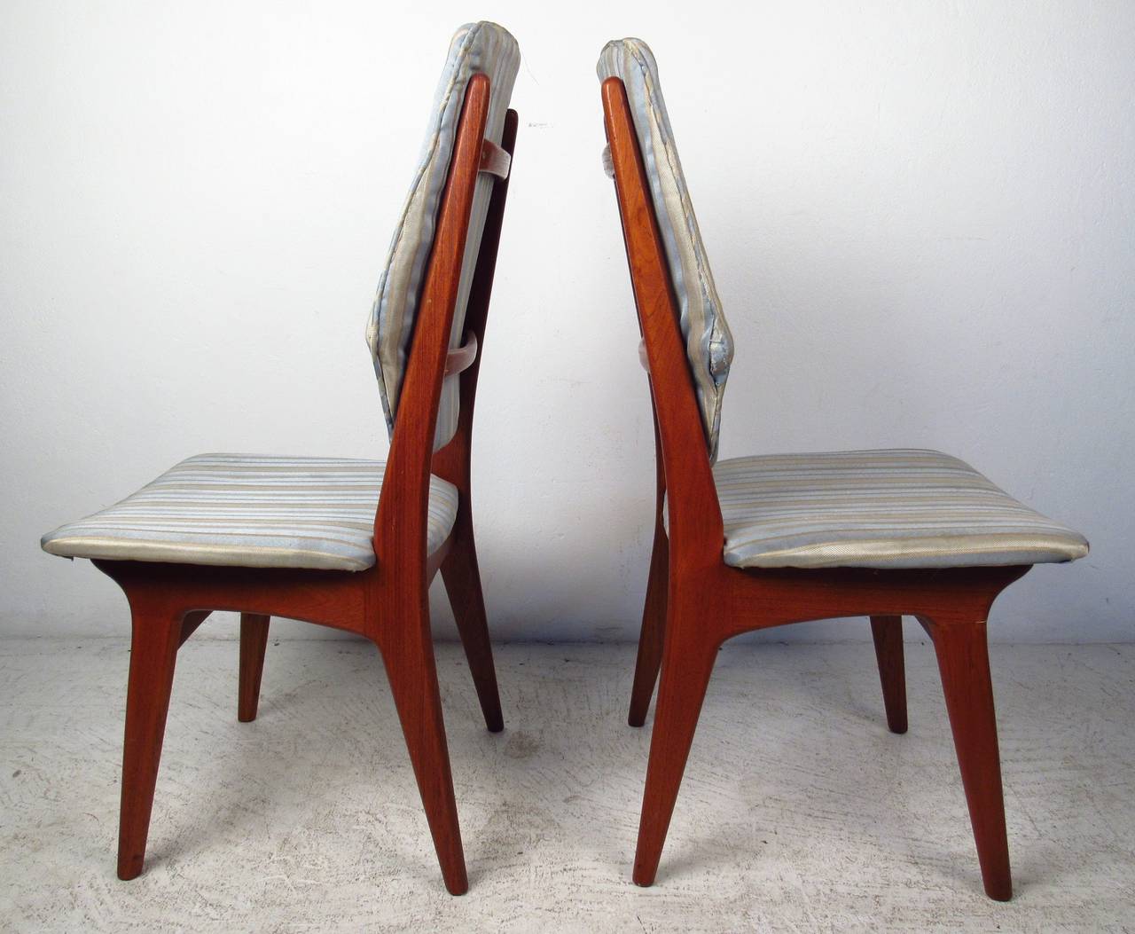 Set of teak Danish modern high back chairs in the style of Hovmand - Olsen. Please confirm item location (NY or NJ) with dealer.