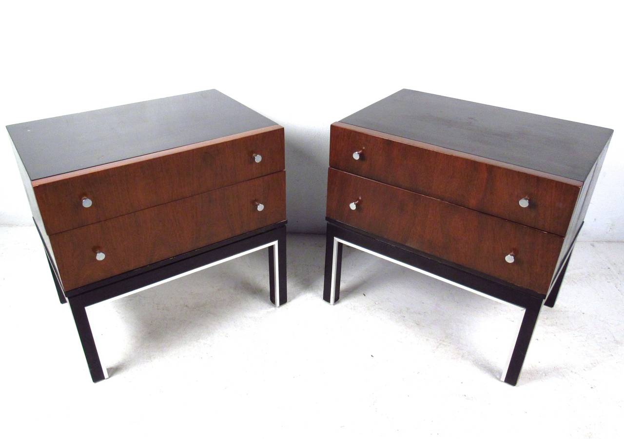 This beautiful pair of Martinsville nightstands features gorgeous veneer drawer fronts paired with ebonized frame and chrome trim. Unique drawer pulls and plenty of storage space round out the stylish practicality of the pair. Please confirm item