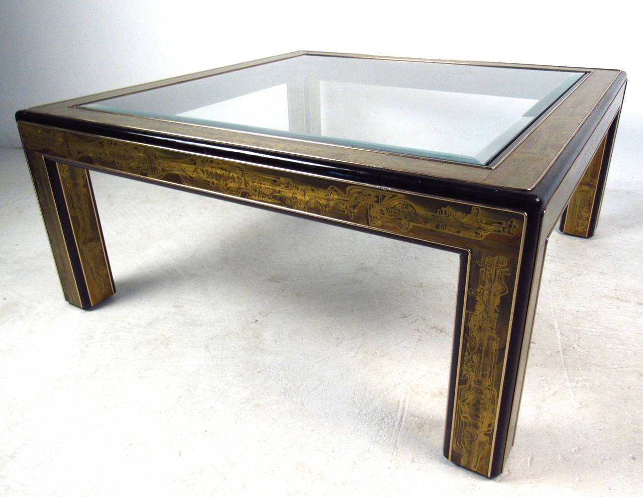 This 1960s acid-etched coffee table still has the original Mastercraft label and features unique intricately designed base, bevelled glass top, and makes a unique and eye-catching addition to any interior. Please confirm item location (NY or NJ).