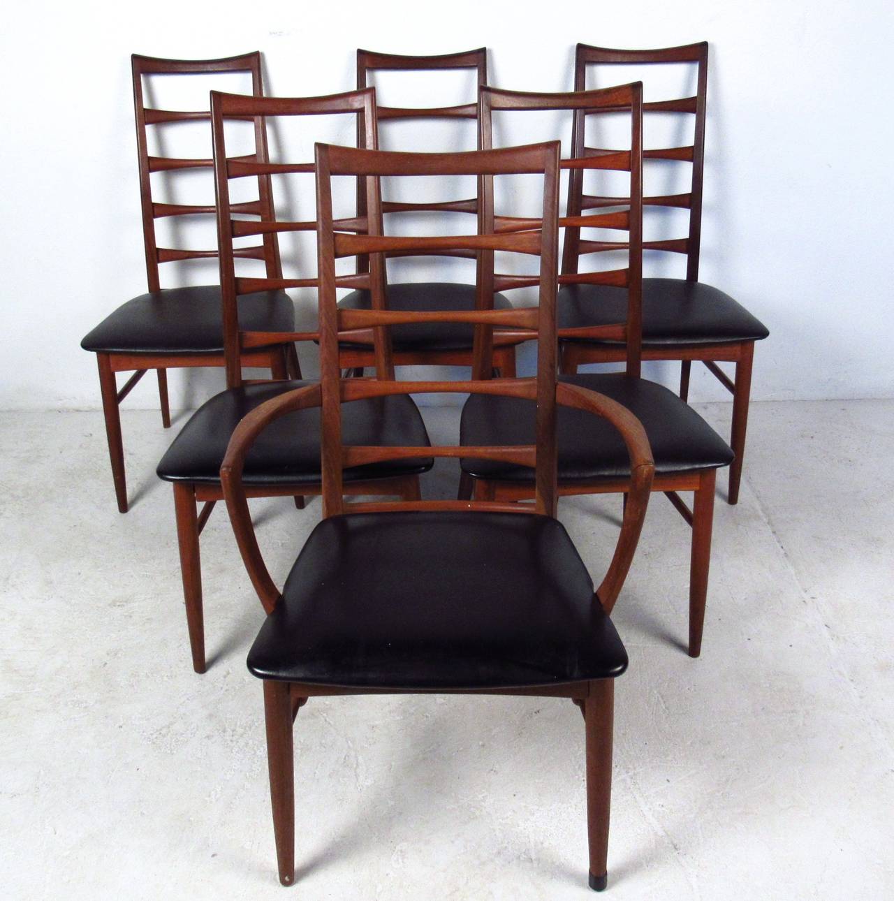 Set of six stylish Mid-Century design featuring sculpted ladder backs and tapered legs. Great arched back, both comfortable and stylish. Designed by Koefoeds Hornslet in the mid-1960s. 

Please confirm item location (NY or NJ.)