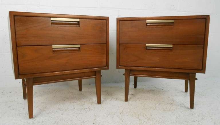 Original finish mid century two drawer nightstands with brass finish pulls by Dillingham Manufacturing co. Please confirm item location (NY or NJ) with dealer.