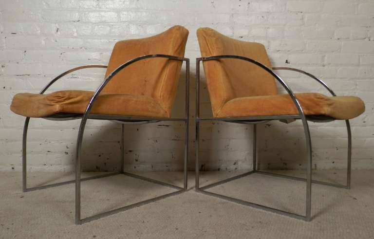Mid-Century Modern chrome frame arm chairs by Milo Baughman. Thin tubular chrome frame with arching front and squared back. Very functional and extremely stylish.

(Please confirm item location - NY or NJ - with dealer).